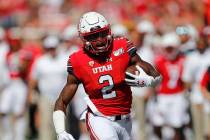 Utah running back Zack Moss (2) carries the ball in the first half of an NCAA college football ...