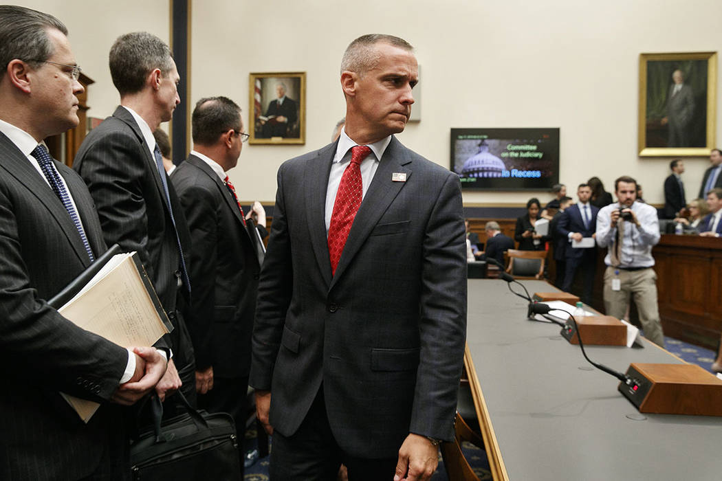 Corey Lewandowski, center, the former campaign manager for President Donald Trump, walks past W ...