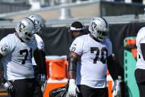 Oakland Raiders offensive linemen, from left, tackle Justin Murray (71) and guard Jonathan Coop ...