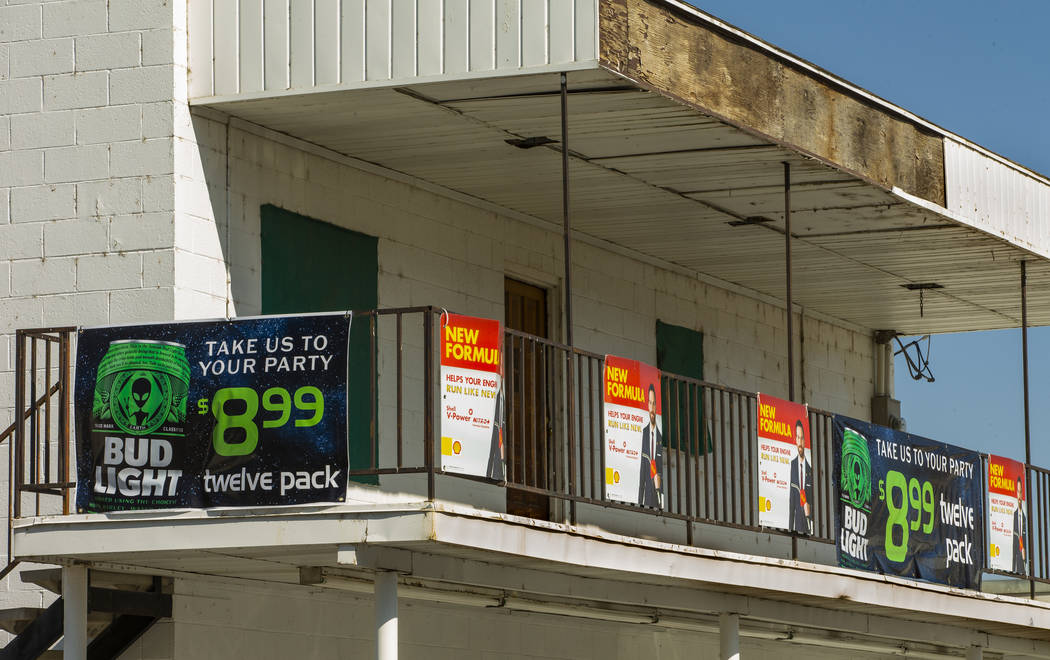 Banners for the limited-edition Bud Light alien cans hang above the Green Valley Grocery store ...