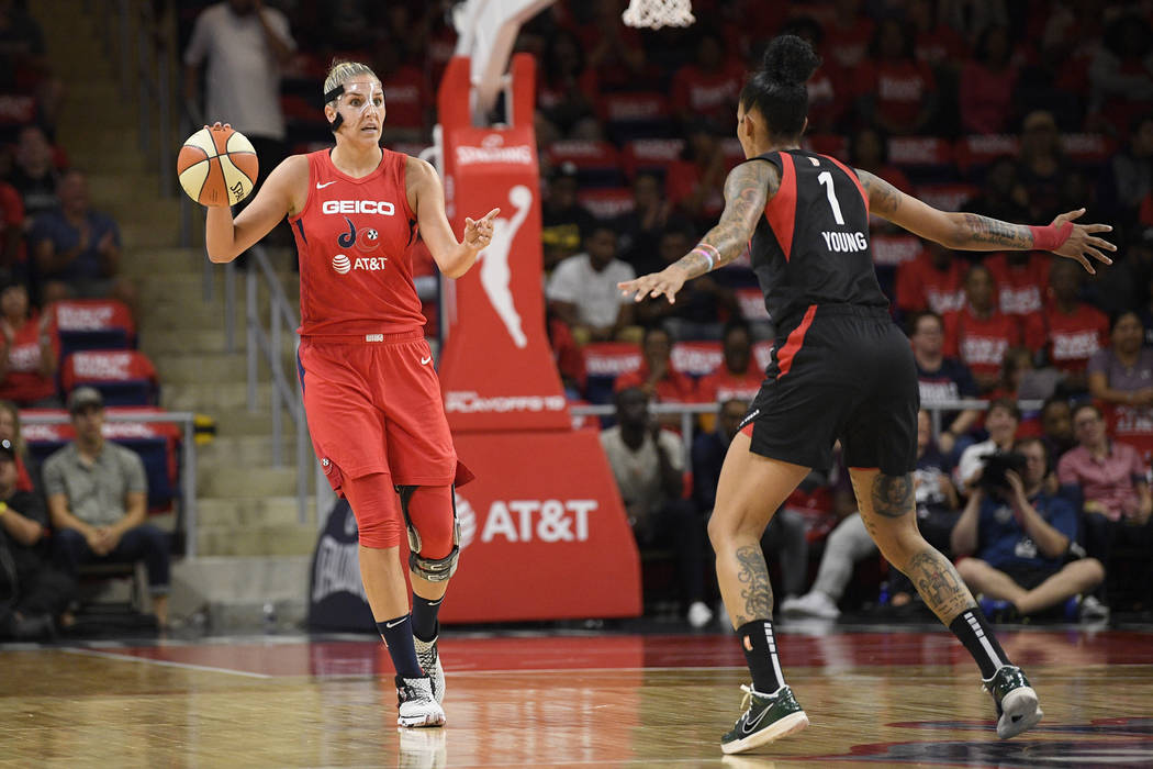 Washington Mystics forward Elena Delle Donne, left, dribbles the ball in front of Las Vegas Ace ...