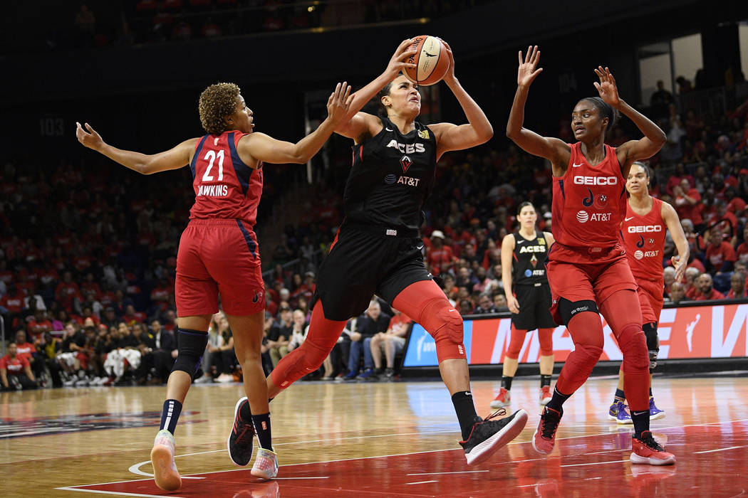 Las Vegas Aces center Liz Cambage (8) goes to the basket against Washington Mystics forward Tia ...