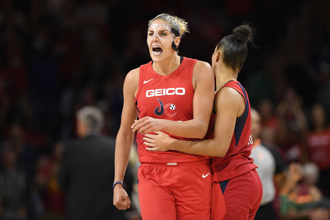 Washington Mystics forward Elena Delle Donne, left, reacts with guard Natasha Cloud, right, aft ...