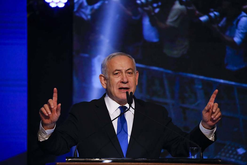 Israeli Prime Minister Benjamin Netanyahu addressees his supporters at party headquarters after ...