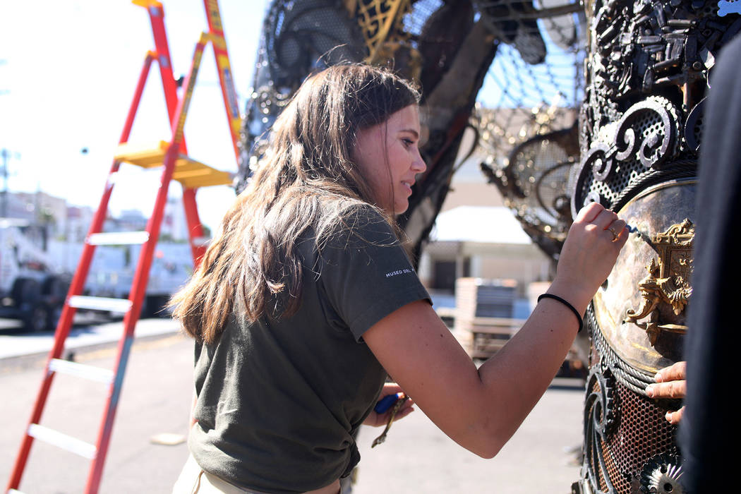 Local Las Vegas artist Tahoe Mack, 18, works on her sculpture of the "Monumental Mammoth" in pr ...