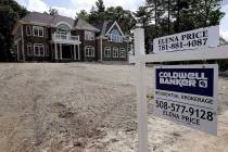 In this Tuesday, Sept. 3, 2019 photo a sign rests in front of a newly constructed home, in West ...