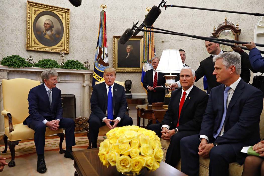Former U.S. hostage in Yemen, Danny Burch, left, listens as President Donald Trump speaks, Marc ...