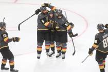 Golden Knights defenseman Deryk Engelland (5) celebrates his goal with Jonathan Marchessault, c ...