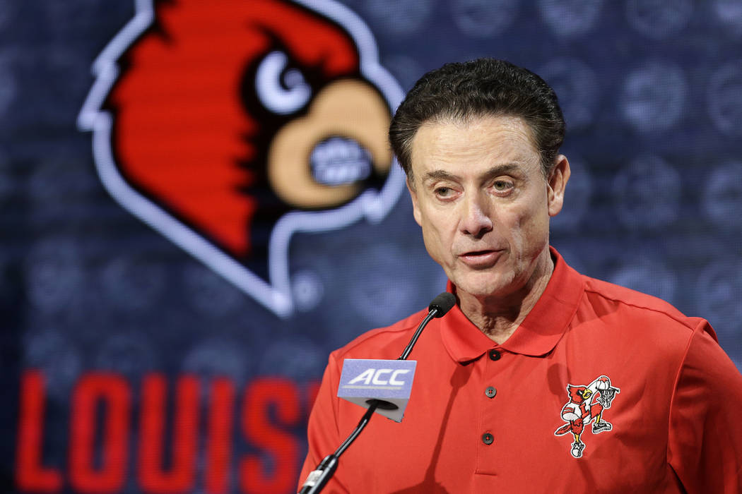 Then-Louisville NCAA college basketball head coach Rick Pitino answers a question during the At ...
