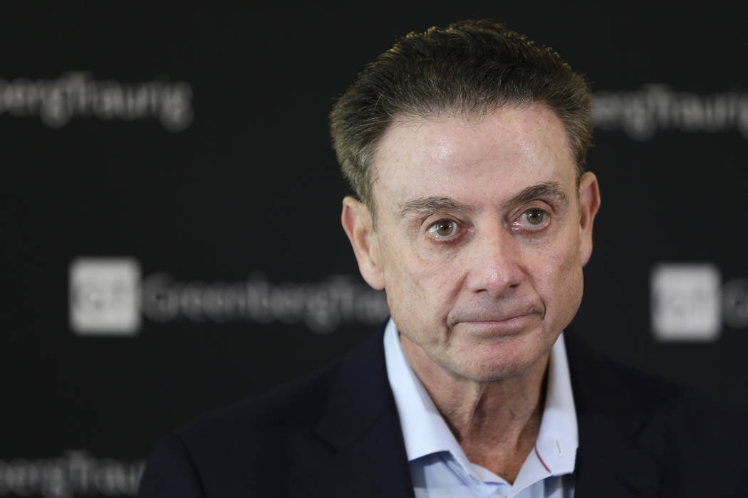 Former Louisville basketball coach Rick Pitino talks to reporters during a news conference in N ...