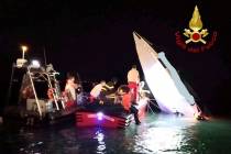 This image provided by firefighters shows the wreckage of a racing boat that allegedly smashed ...