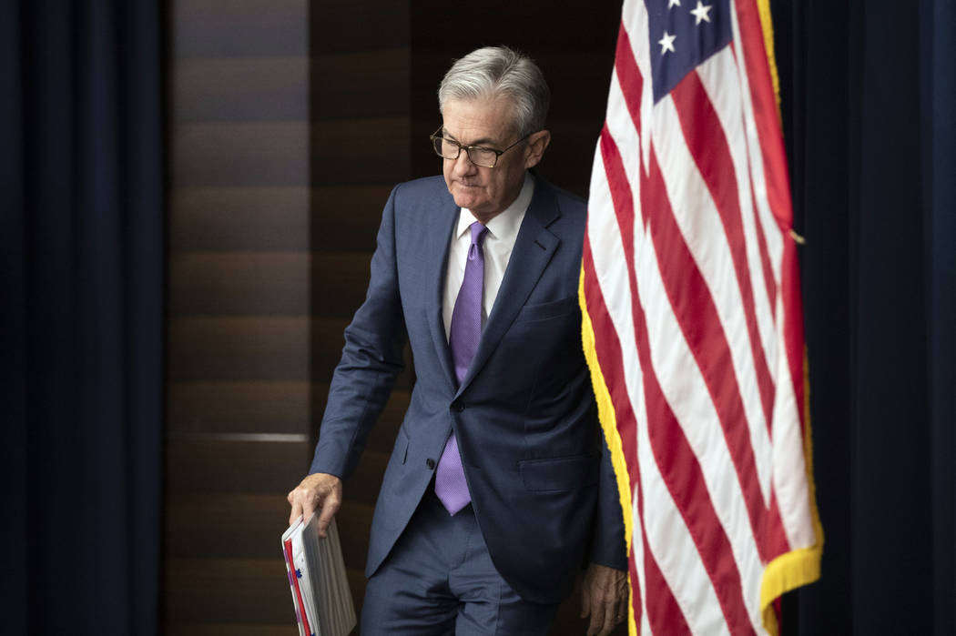 FILE - In this July 31, 2019, file photo Federal Reserve Chairman Jerome Powell walks to the po ...