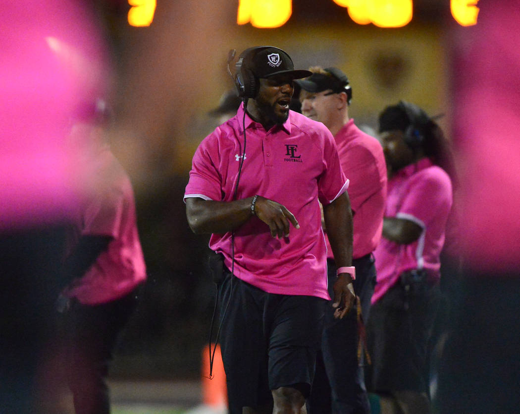 Faith Lutheran head coach Vernon Fox walks the sideline in the first half of a game against Arb ...