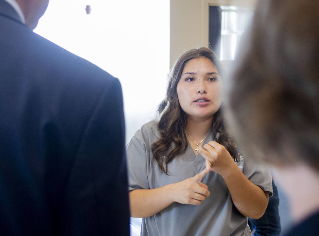 Health information management junior Giselle Lopez, 16, gives a tour to people from the U.S. De ...