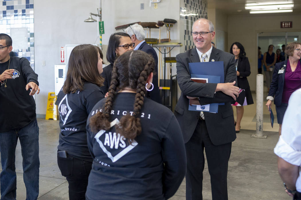 Assistant U.S. Secretary of Education Scott Stump, right, visits a welding and mechanics class ...