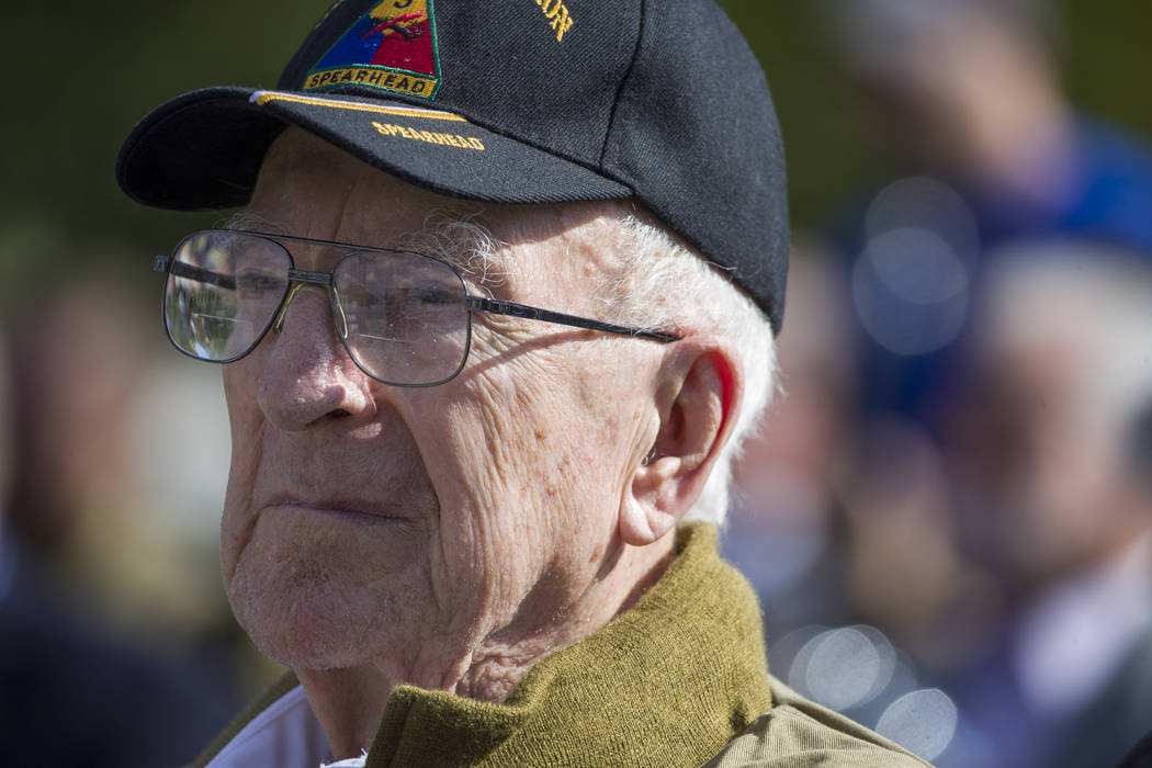 World War II veteran Clarence Smoyer, 96, sits before receiving the Bronze Star at the World Wa ...