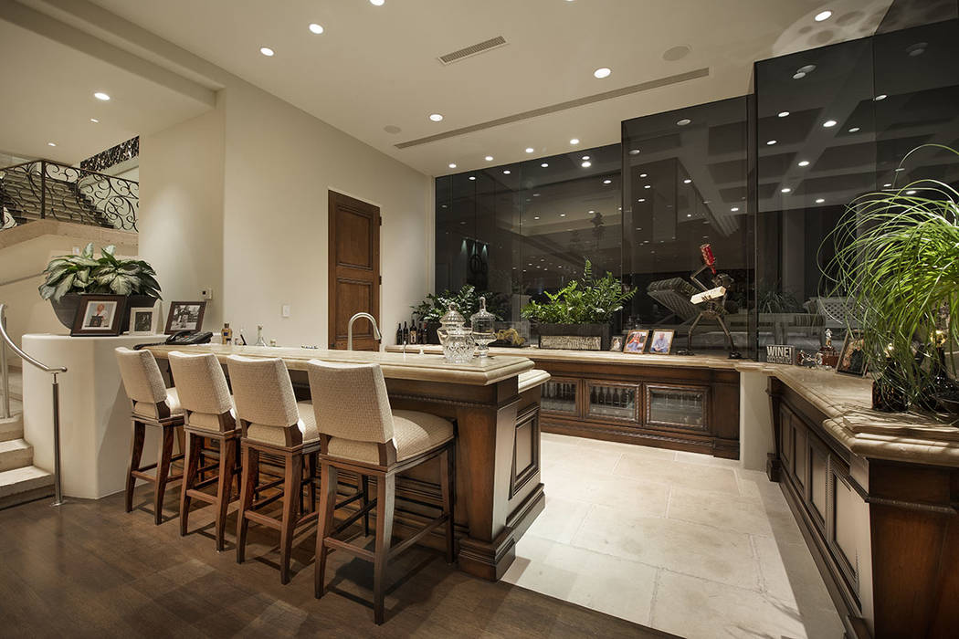 There is a large bar on the first level. (Synergy Sotheby’s International Realty)