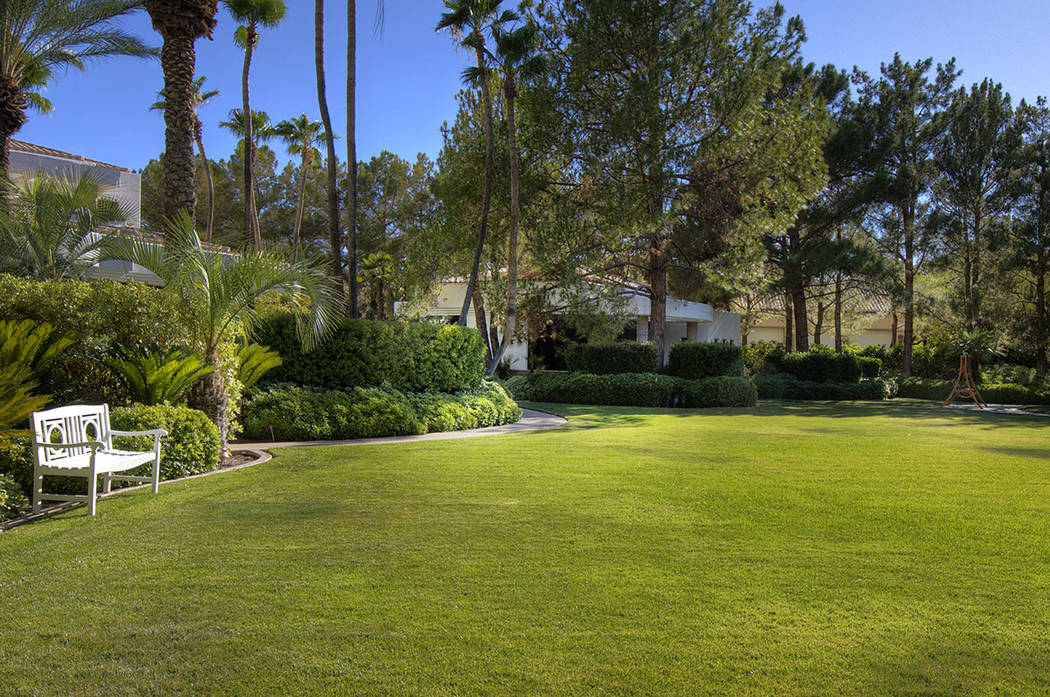 There is a grassy area in front of the guest home. (Synergy Sotheby’s International Realty)