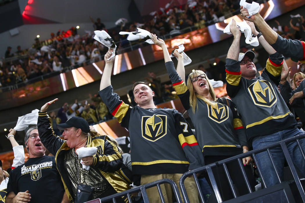 Golden Knights fans celebrate a goal by Golden Knights center Jonathan Marchessault, not pictur ...