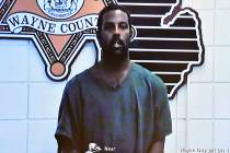 Deangelo Martin is displayed on a monitor during his video arraignment at 36th District Court, ...