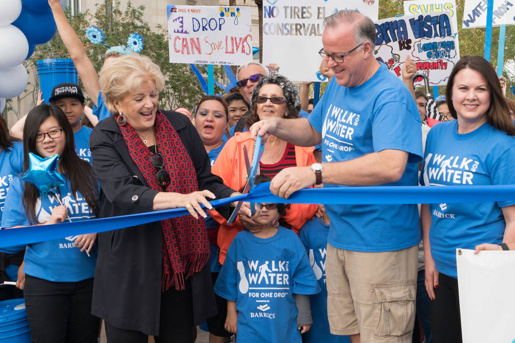 Mayor Carolyn Goodman and Jerry Nadal of Cirque du Soleil cut the ribbon at One Drop Walk for W ...