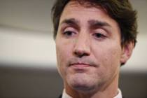 Canadian Prime Minister and Liberal Party leader Justin Trudeau reacts as he makes a statement ...