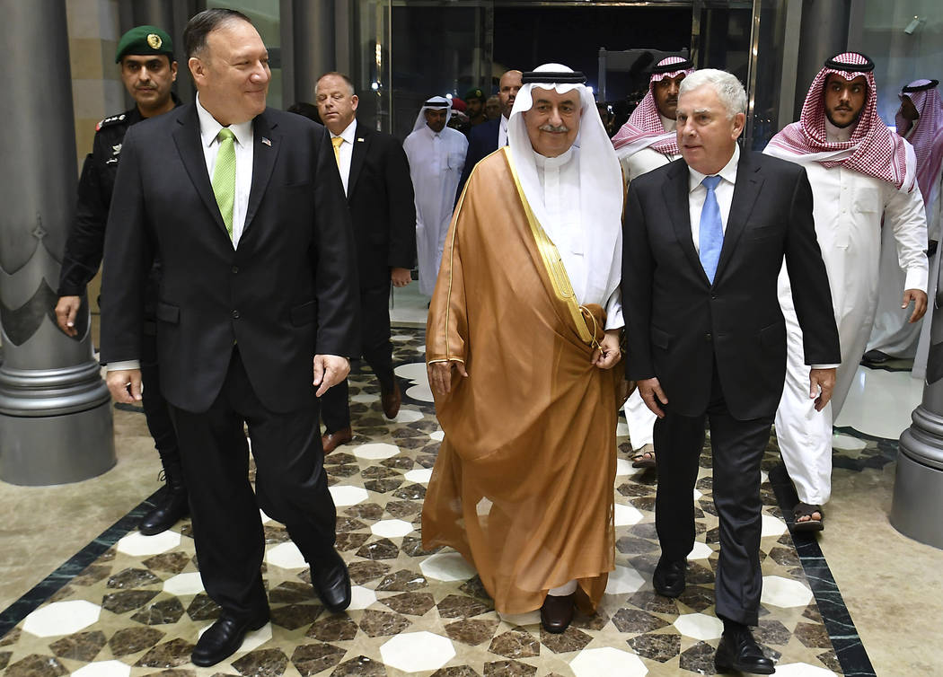Secretary of State Mike Pompeo, left, walks with U.S. ambassador to Saudi Arabia John Abizaid, ...