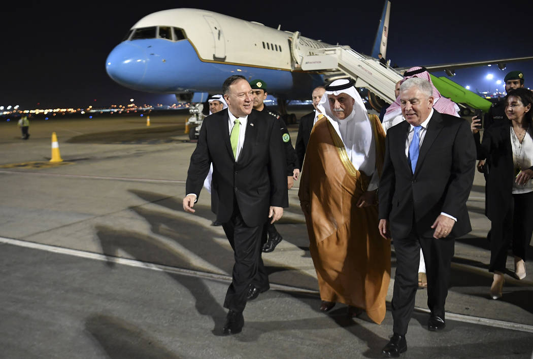 Secretary of State Mike Pompeo walks after stepping off his plane upon arrival at King Abdulazi ...