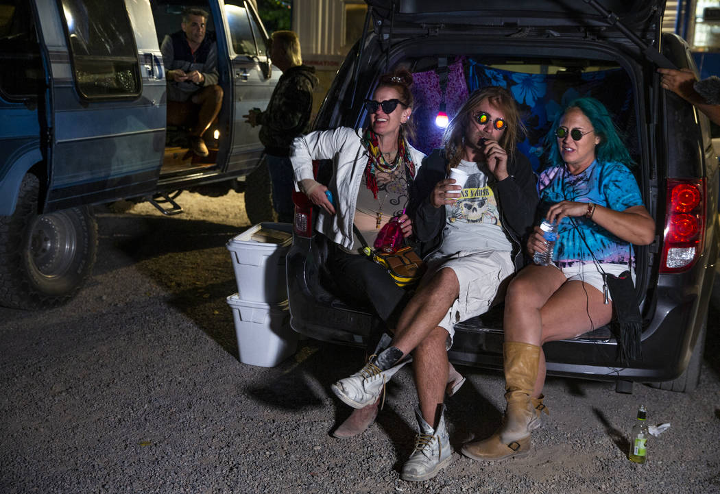 Marge Lemay, left, Martin Bo Jarski and Karen Peterson relax in a van outside the Little A'Le'I ...
