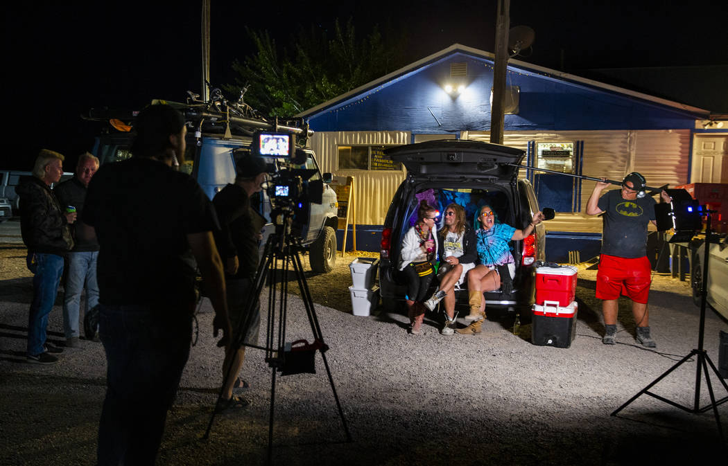 Marge Lemay, left, Martin Bo Jarski and Karen Peterson give an interview while relaxing in a va ...