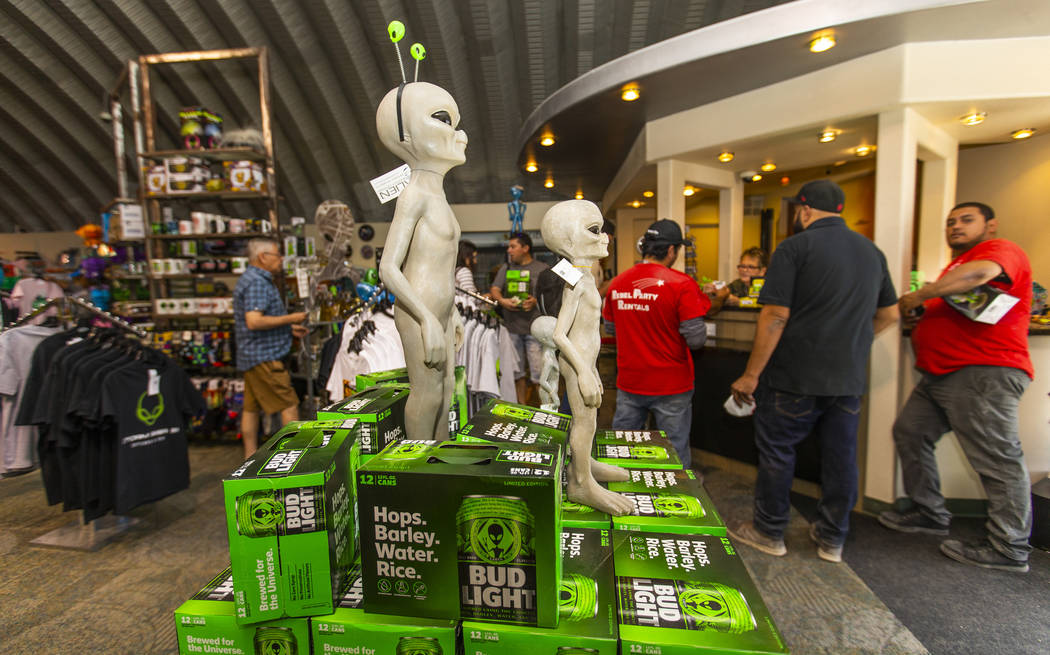 Customers line up for merchandise in the Alien Research Center which is the home of the Area 5 ...