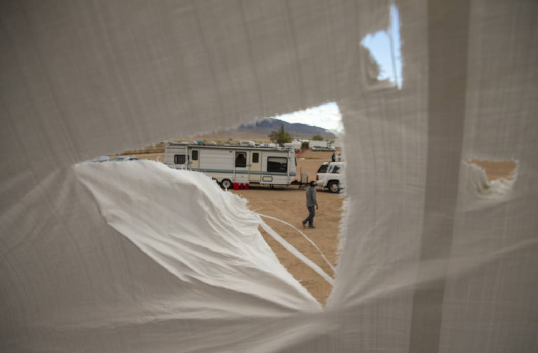 Rips in the main stage roof tarp are increasing while the winds pick up near the start of the A ...