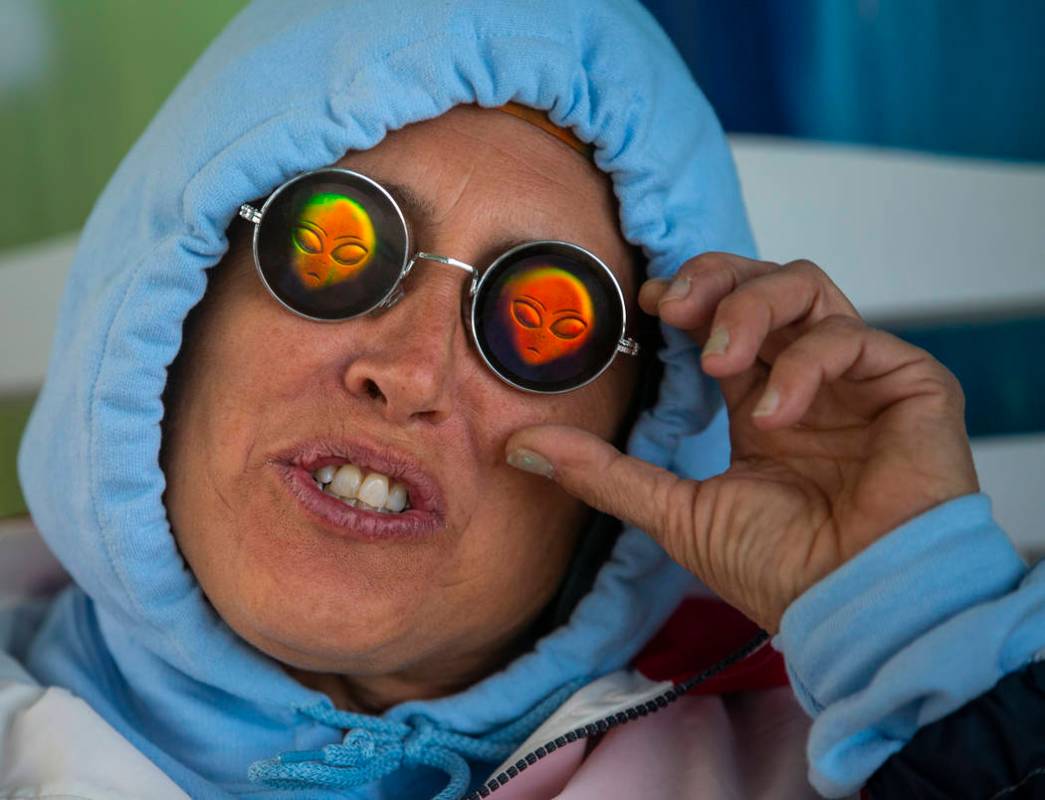 Festivalgoer Karen Peterson sports some alien sunglasses as the start of the Alienstock festiva ...