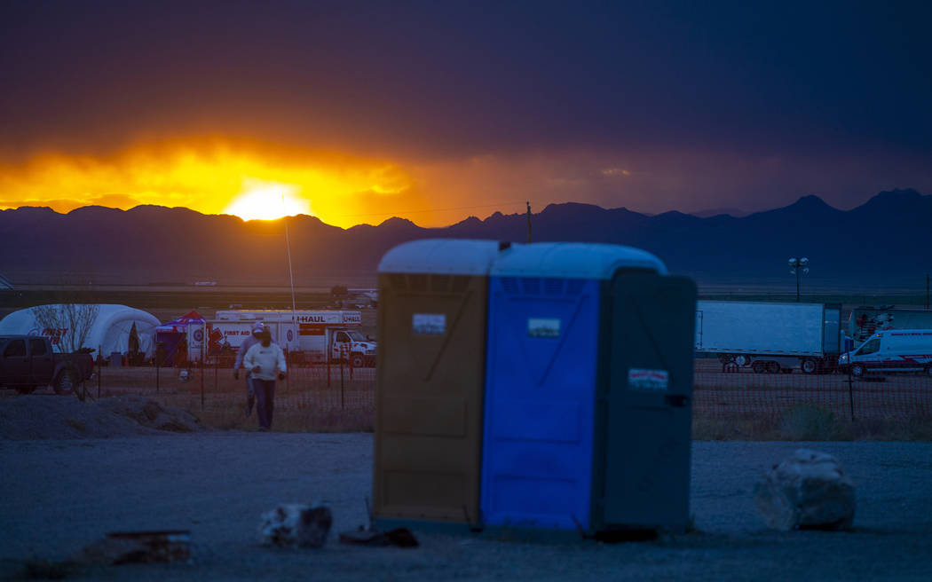 The sun sets on festivalgoers as the start of the Alienstock festival nears on Thursday, Sept. ...