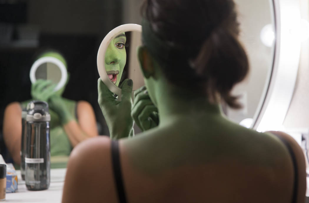 Mariand Torres, who plays Elphaba in "Wicked," applies lipstick before the show at The Smith Ce ...