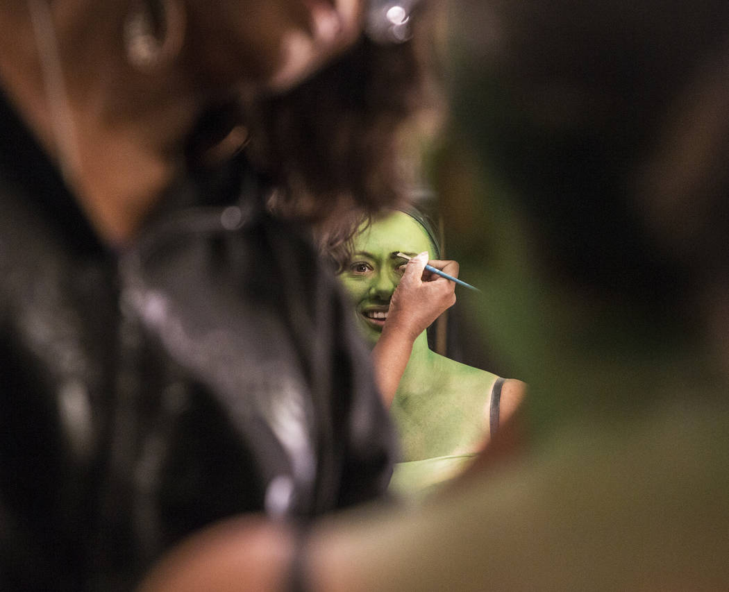 Mariand Torres, who plays Elphaba in "Wicked," gets her makeup done before the show at The Smit ...