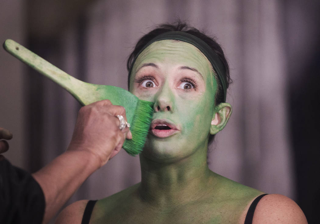 Mariand Torres, who plays Elphaba in "Wicked," gets her makeup done before the show at The Smit ...