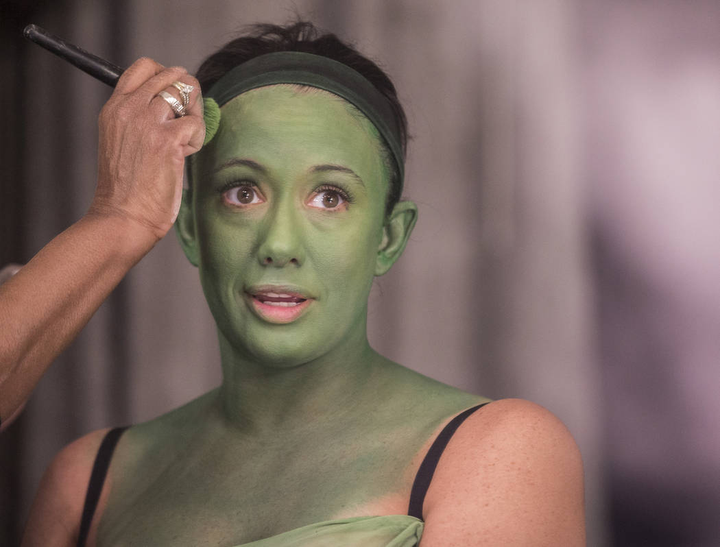 Mariand Torres, who plays Elphaba in "Wicked," gets her makeup done before the show at The Smit ...