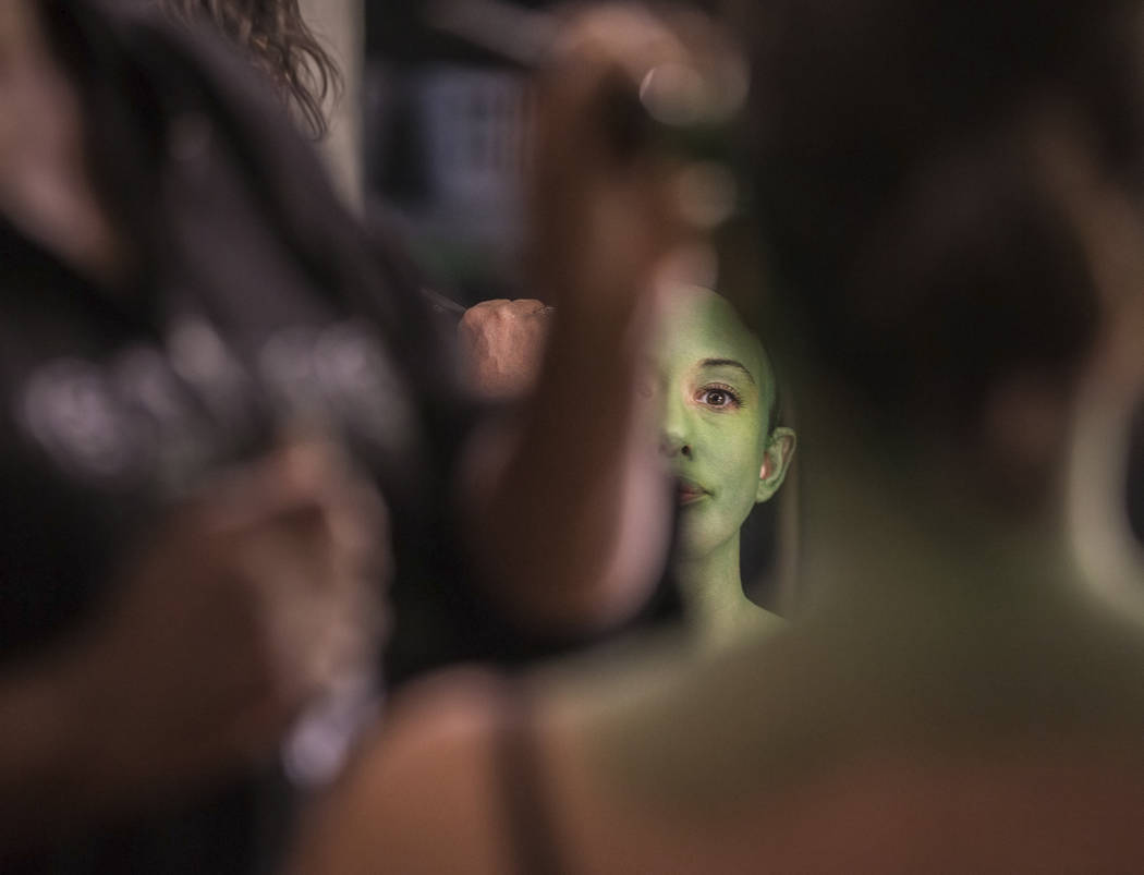 Mariand Torres, who plays Elphaba in "Wicked," gets her makeup done before the show at The Smit ...