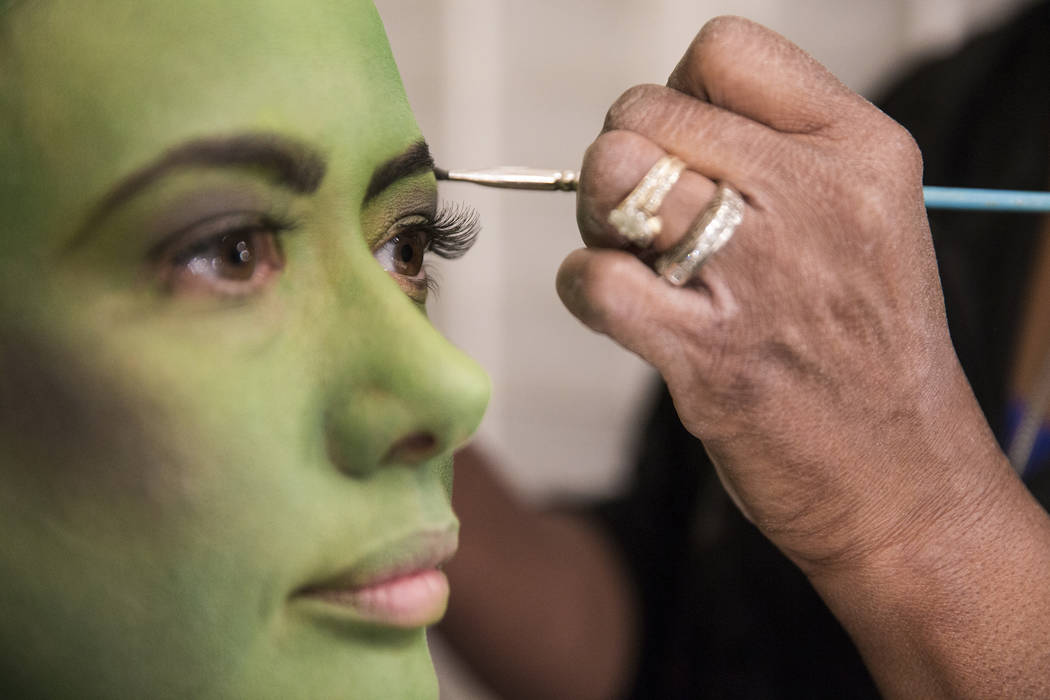 Mariand Torres, who plays Elphaba in "Wicked," gets her makeup done before the show at The Smit ...