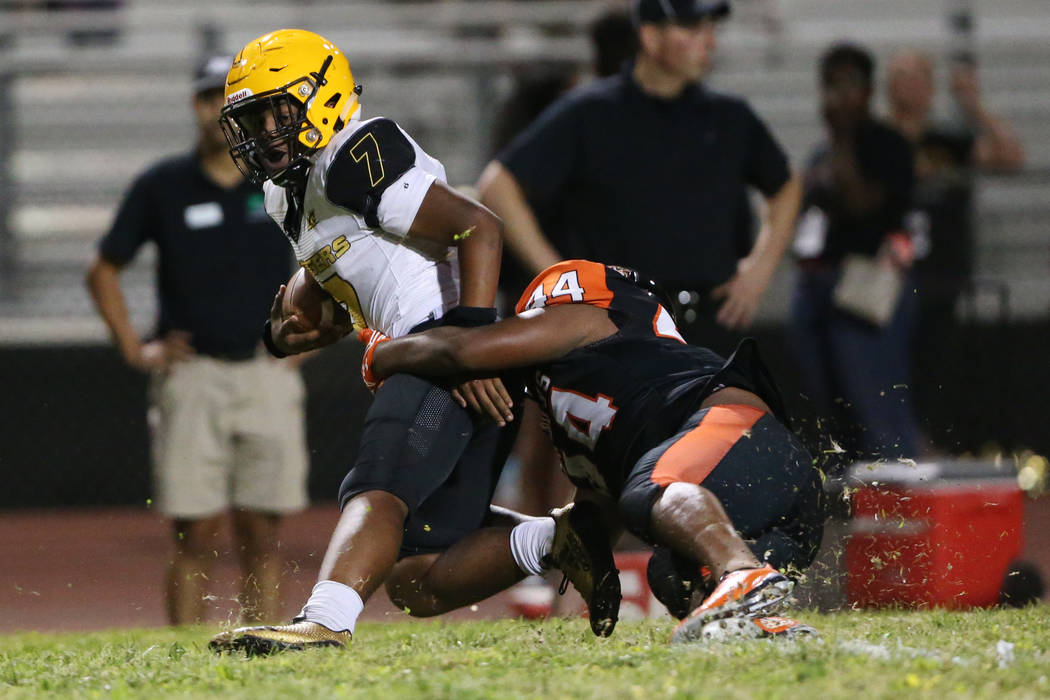 Clark's My'quel Johnson (7) is tackled by Chaparral's Robert Whitstone (44) in the second quart ...
