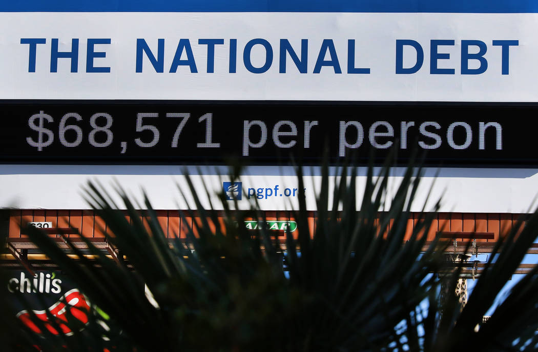 A billboard depicting rising national debt is seen on Las Vegas Boulevard directly across from ...