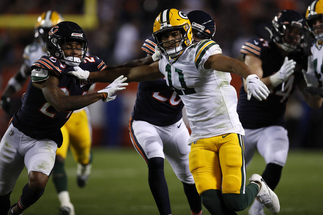 Green Bay Packers cover man Trevor Davis (11) battles with Chicago Bears cornerback Buster Skri ...