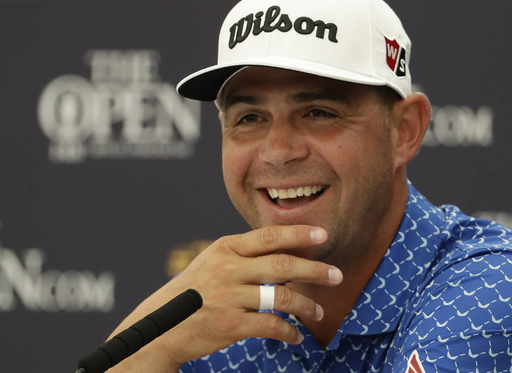Gary Woodland of the United States smiles as he listens to a question from the media during a p ...