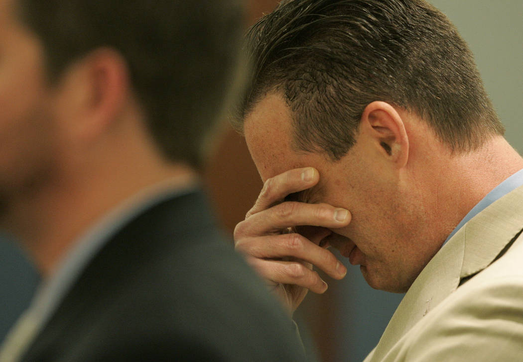 Chiropractor Dr. Stephen Shaw, right, weeps at the Regional Justice Center in Las Vegas Friday, ...
