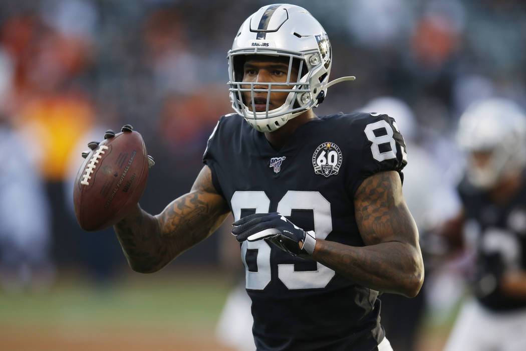 Oakland Raiders tight end Darren Waller warms up before an NFL football game against the Denver ...