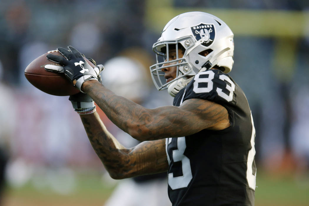 FILE - In this Sept. 9, 2019, file photo, Oakland Raiders tight end Darren Waller warms up befo ...