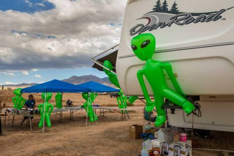 Aliens hang on a merchandise and supply tent as the start of the Alienstock festival nears on T ...