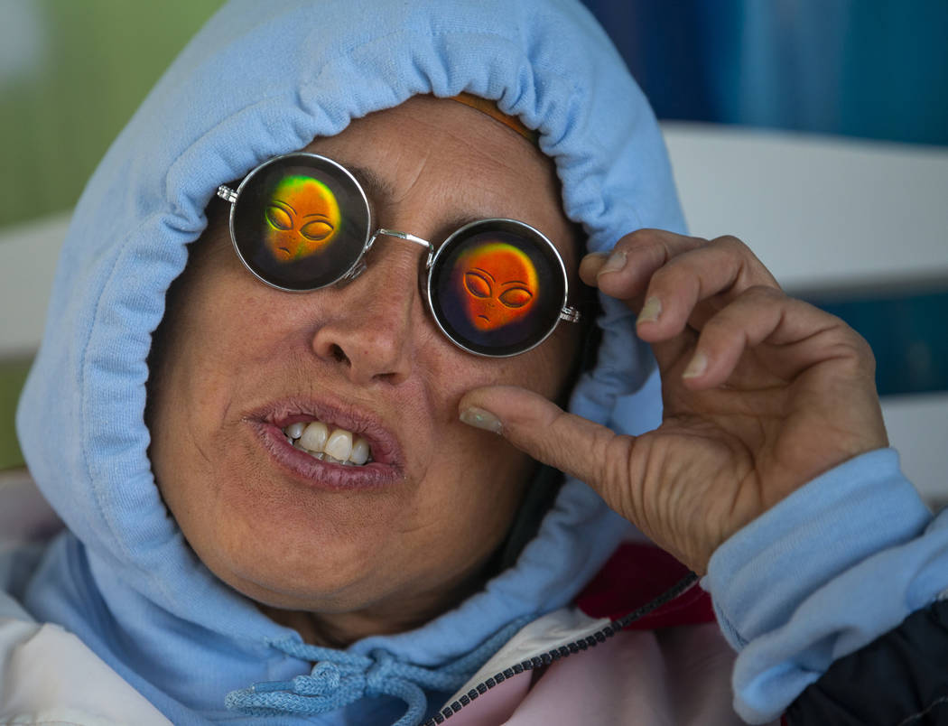 Festivalgoer Karen Peterson sports some alien sunglasses as the start of the Alienstock festiva ...
