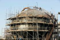 During a trip organized by Saudi information ministry, workers fix the damage in Aramco's oil s ...